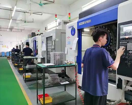 Production engineer reviewing a high-volume machining programme
