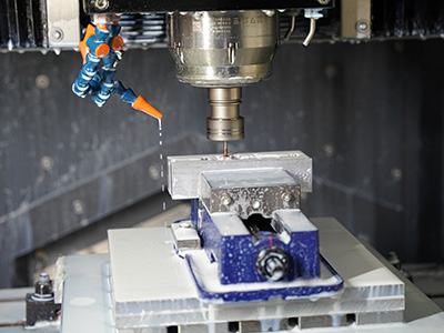 Multi-axis CNC milling centre cutting a complex machined component
